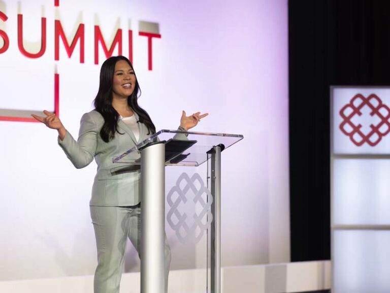 presenter on stage at connect summit