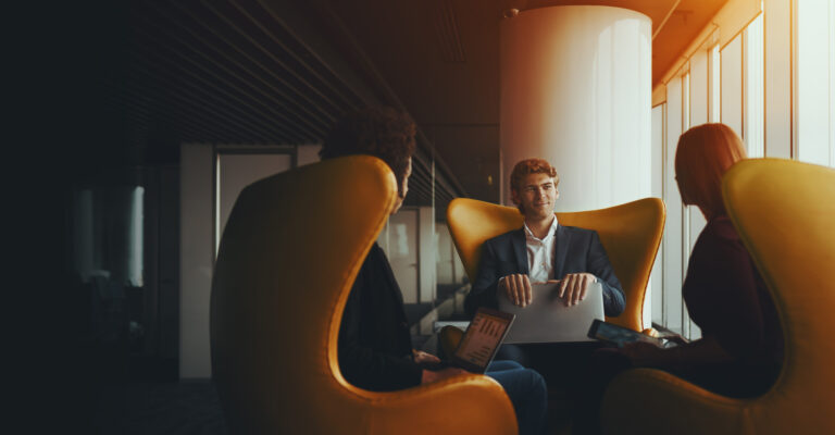 three people meeting