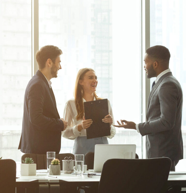 three people talking in a meeting