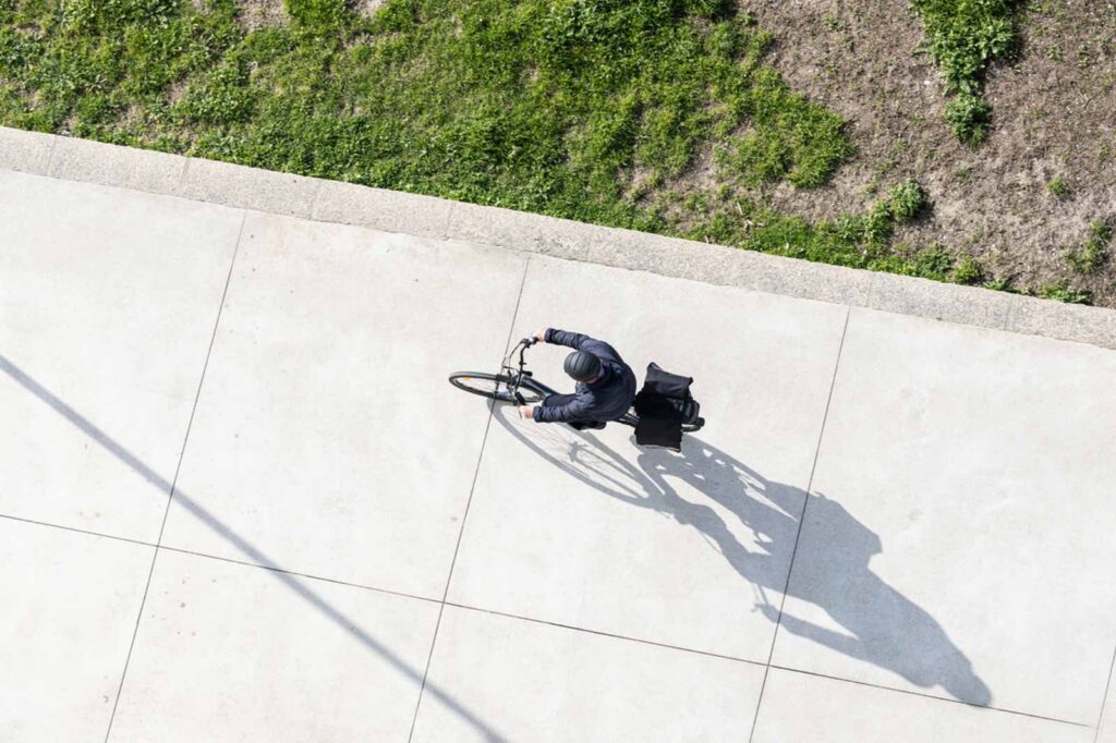 overhead photo of person riding a bike